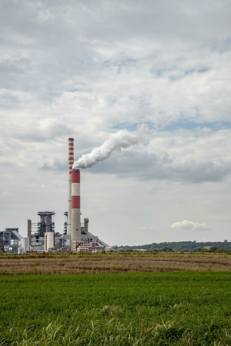 View of a power plant emitting smoke, showcasing industrial energy production.